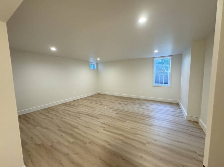 LVP Flooring, Vinyl Flooring, Interior Remodeling, Interior Design, Benjamin Moore Paint, New trim, Spacious Design, Basement Remodeling, Basement Design, New Electrical