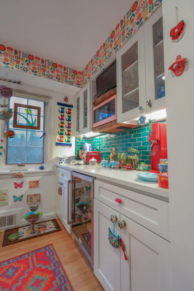 Refinished Hardwood Flooring, Interior Remodeling, Exterior Remodeling, Maximalist Colors, Maximalist Design, Interior Design, Green Backsplash, Green Island, Quartz Counters, Farmhouse Sink, Geometric Sink, Colorful Wallpaper, Painted Hood Vent, Custom Floating Shelving
