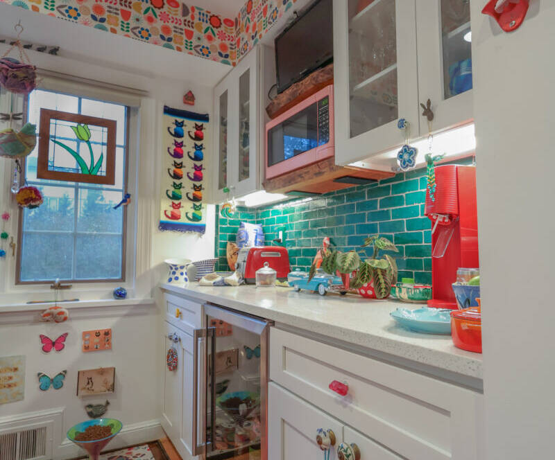 Refinished Hardwood Flooring, Interior Remodeling, Exterior Remodeling, Maximalist Colors, Maximalist Design, Interior Design, Green Backsplash, Green Island, Quartz Counters, Farmhouse Sink, Geometric Sink, Colorful Wallpaper, Painted Hood Vent, Custom Floating Shelving